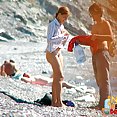 Amateurs sunbathing naked on beach - image 