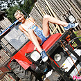 Pinky June on tractor - image 